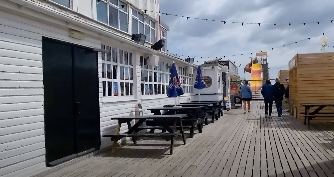 Image of people walking along Britannia Pier