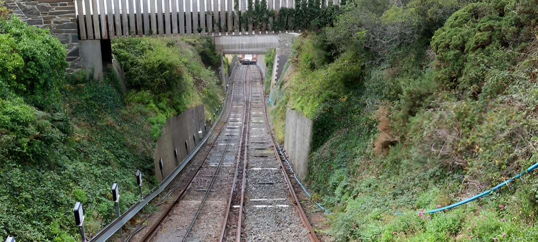 View from carriage down the railway, which is steep and has bushes on each side