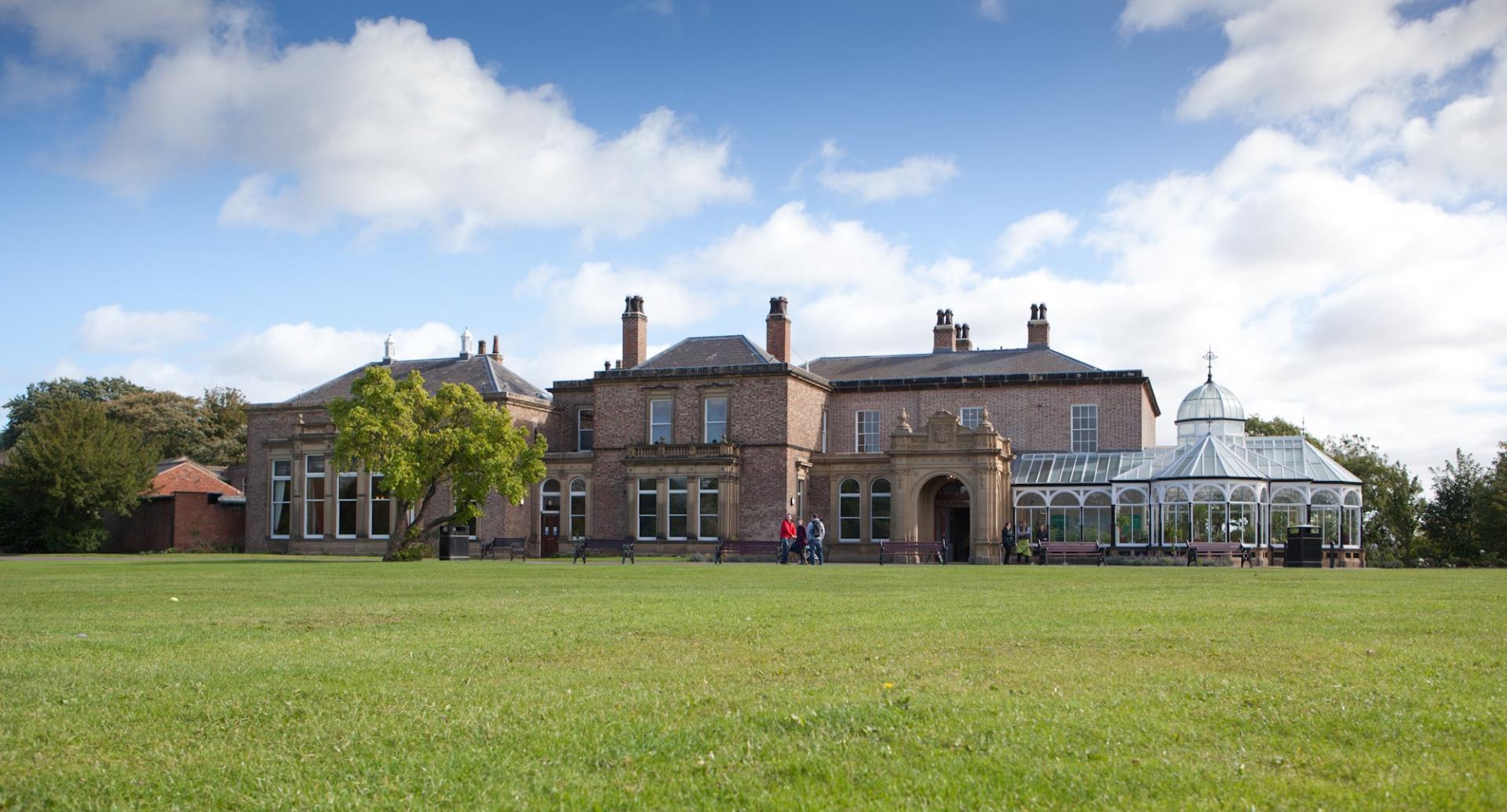 Front view of the Museum with field in front.